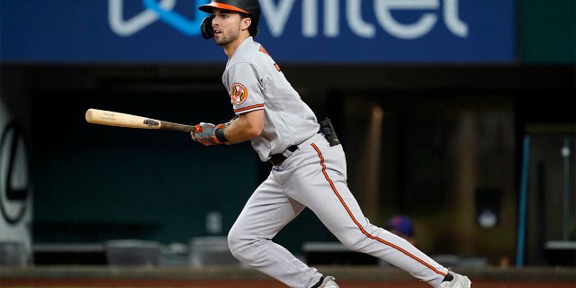 Baltimore Orioles' Terrin Vavra follows through on a run-scoring double in the eighth inning of a baseball game against the Texas Rangers, Wednesday, Aug. 3, 2022, in Arlington, Texas. The hit scored Jorge Mateo.