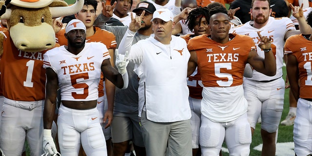 Head coach Steve Sarkisian stands with his Longhorns players after the Orange-White Spring Game at Darrell K Royal-Texas Memorial Stadium on April 23, 2022, in Austin, Texas.