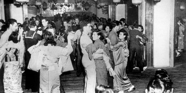 U.S. servicemen and Japanese women dancing at the Oasis nightclub, Tokyo, 1945. Joel Pritchard, Washington state politician and creator of pickleball, served in the U.S. Army occupation force in Tokyo after World War II.
