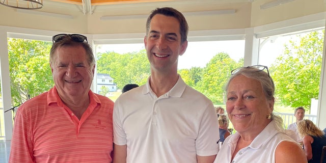 Republican Sen. Tom Cotton of Arkansas (center) teams up with New Hampshire GOP chair Steve Stepanek and RNC committee member Juliana Bergeron at an NHGOP fundraiser in Rye, N.H. on Aug. 16, 2022.