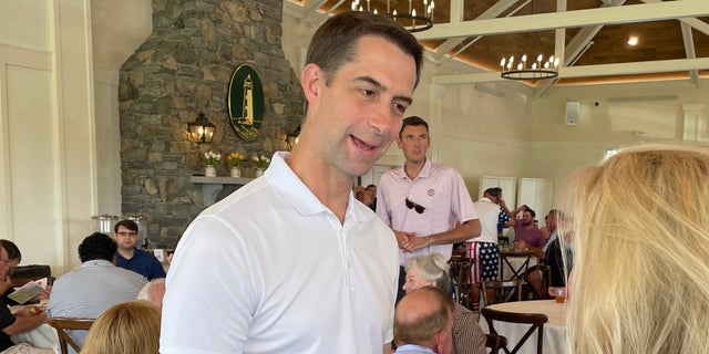 Republican Senator Tom Cotton of Arkansas speaks with an activist during a New Hampshire GOP fundraiser in Rye, NH on August 16, 2022.