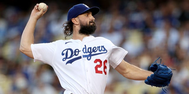 Tony Gonsolin #26 of the Los Angeles Dodgers pitches against the San Diego Padres during the first inning at Dodger Stadium on August 05, 2022 in Los Angeles, California.