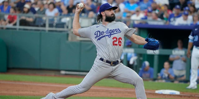 Starting pitcher Tony Gonsolin #26 of the Los Angeles Dodgers throws against the Kansas City Royals  at Kauffman Stadium on August 12, 2022, in Kansas City, Missouri.