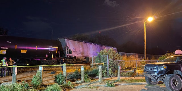 Two train cars in El Paso, Texas, derailed Monday evening, killing at least one person and damaging a gas line, fire officials said.