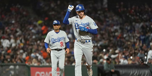 Trea Turner of the Los Angeles Dodgers pumps his fist after hitting a home run against the San Francisco Giants in the seventh inning on August 1, 2022 in San Francisco.