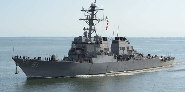 The guided-missile destroyer USS Arleigh Burke transits the Chesapeake Bay on its way back into port. 