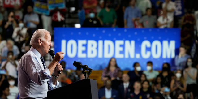 President Joe Biden speaks during a rally hosted by the Democratic National Committee.