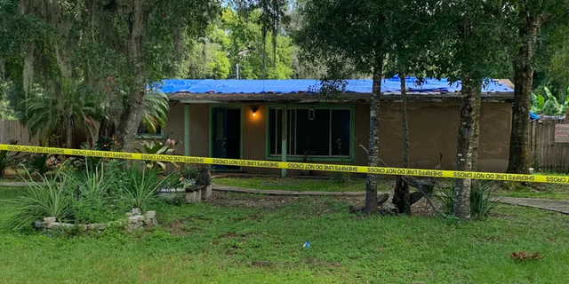 A Florida man was killed after he allegedly broke into a house and got into bed with the homeowner, all while carrying a machete.