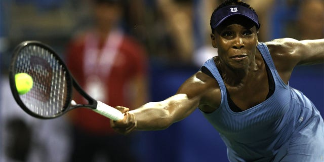 Venus Williams of the United States returns a shot to Rebecca Marino of Canada during Day 3 of the Citi Open at Rock Creek Tennis Center on August 01, 2022 in Washington, DC.
