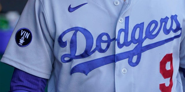 A patch honoring broadcaster Vin Scully is shown on the jersey of Los Angeles Dodgers second baseman Gavin Lux before the team's baseball game against the San Francisco Giants in San Francisco, Wednesday, Aug. 3, 2022.