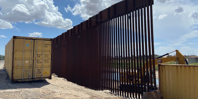 Gov. Doug Ducey ordered the construction of the border wall to continue using shipping containers.