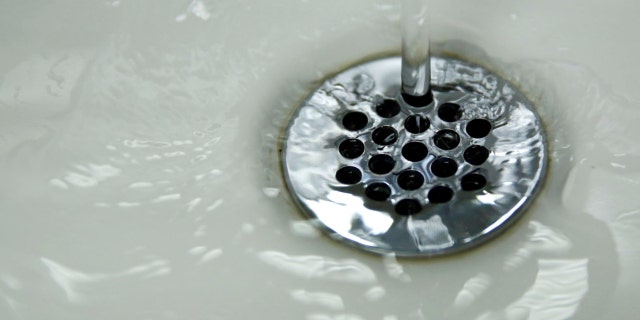 Running tap water is seen in Flint, a city struggling with the effects of lead-poisoned drinking water in Michigan, May 4, 2016. 