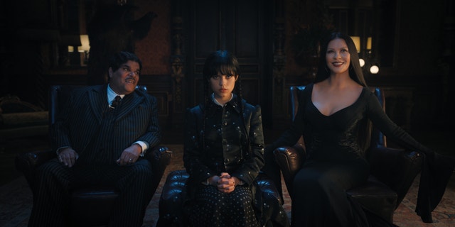 Luis Guzmán stars Gomez Addams, Jenna Ortega as Wednesday Addams and Catherine Zeta-Jones as Morticia Adams in Netlfix's upcoming spin-off series "Wednesday."