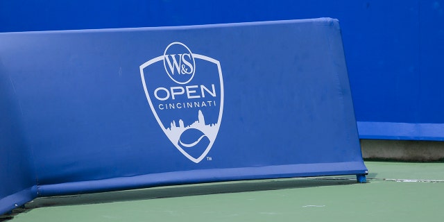 A view of the tournament logo on the court barrier during the Western and Southern Open tennis tournament at Lindner Family Tennis Center in Mason, Ohio August 16, 2021.
