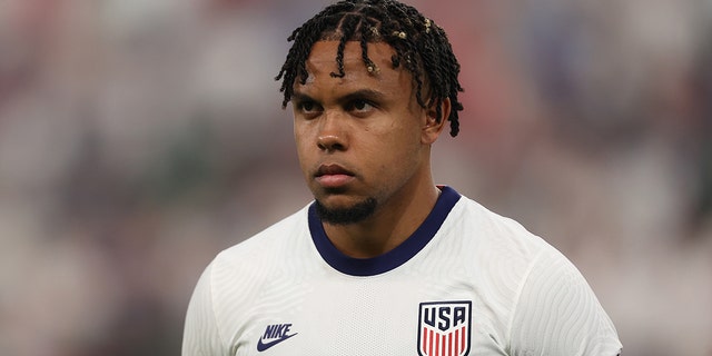 Weston McKennie stands for the national anthem before a match against Grenada at Q2 Stadium on June 10, 2022, in Austin, Texas.