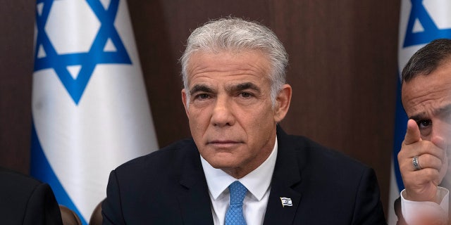 Israeli Prime Minister Yair Lapid prepares to make a statement at the start of the weekly cabinet meeting in Jerusalem.