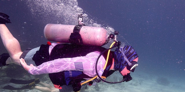 A military veteran dives in Islamorada, Florida, on a coral reef conservation mission with Force Blue, Inc., in June 2022.