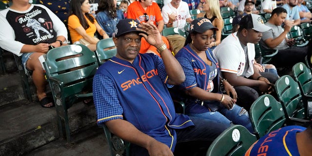 The parents of Houston Astros' Yordan Alvarez, Agustín Eduardo Álvarez Salazar, left, and Mailyn Cadogan Reyes watch the Minnesota Twins and Houston Astros play a baseball game Tuesday, Aug. 23, 2022, in Houston. Alvarez's parents got to see him play as a professional for the first time Tuesday night after arriving from Cuba Friday.
