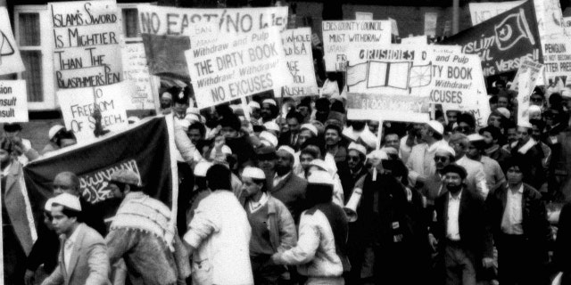 People protest Salman Rushdie's "The Satanic Verses" in 1989.