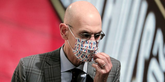 NBA Commissioner Adam Silver is shown wearing a mask.