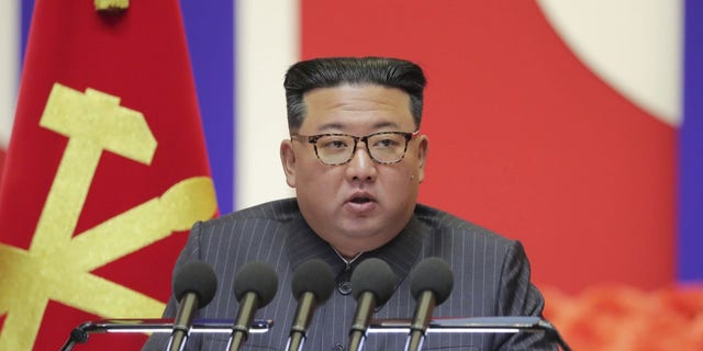 In this photo provided by the North Korean government, North Korean leader Kim Jong Un speaks during a "maximum emergency anti-epidemic campaign meeting" in Pyongyang, North Korea, Wednesday, Aug. 10, 2022.