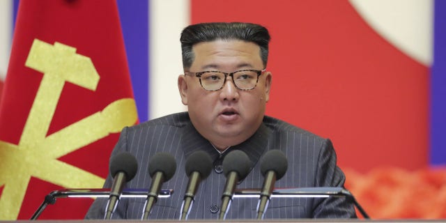 In this photo provided by the North Korean government, North Korean leader Kim Jong Un speaks during a "maximum emergency anti-epidemic campaign meeting" in Pyongyang, North Korea, Wednesday, Aug. 10, 2022.