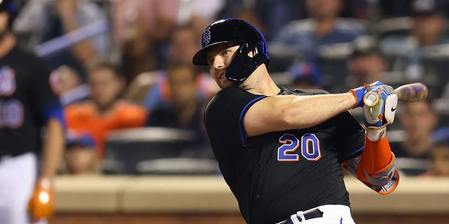 Pete Alonso #20 of the New York Mets hits a walk-off single in the bottom of the ninth inning to defeat the Colorado Rockies 7-6 at Citi Field on August 26, 2022 in New York City. 