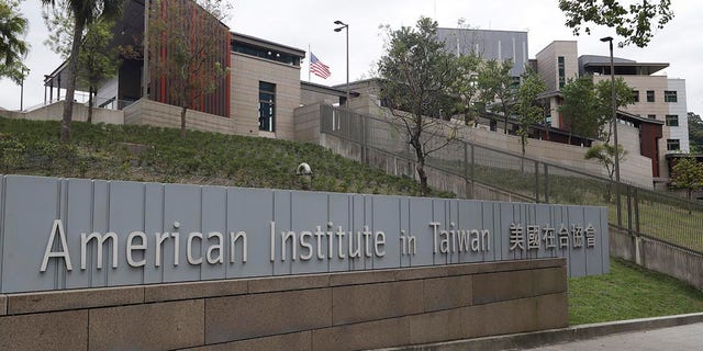 U.S. flag flies at American Institute in Taiwan, or AIT in Taipei, Taiwan, Wednesday, Nov. 10, 2021. (AP Photo/Chiang Ying-ying, File)