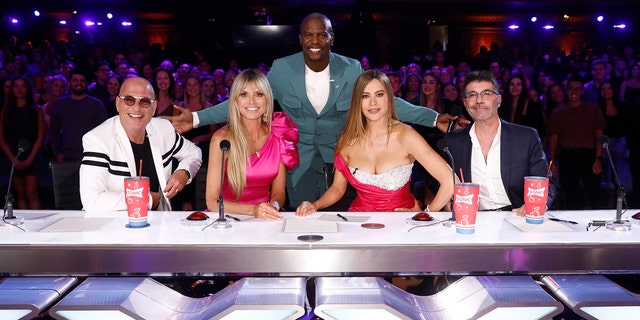 "America’s Got Talent" host Terry Crews, center, is flanked by judges Howie Mandel, Heidi Klum, Sofia Vergara and Simon Cowell.