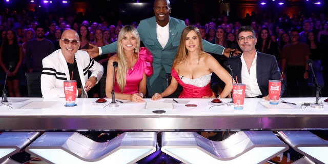 "America’s Got Talent" host Terry Crews, center, is flanked by judges Howie Mandel, Heidi Klum, Sofia Vergara and Simon Cowell.