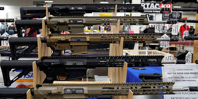 AR-15 rifles are displayed for sale at the Guntoberfest gun show in Oaks, Pennsylvania, Oct. 6, 2017.