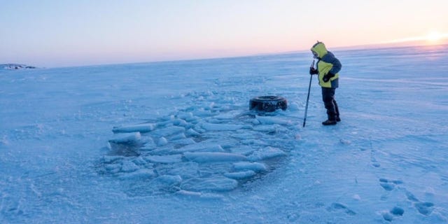 The truck fell through the ice on its way back to dry land.