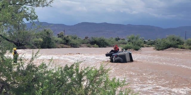 Rescuers cautioned drivers not to drive through flooded roadways.