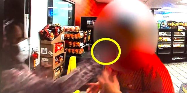Police said a woman entered a gas station store and hit a worker in the face with a brick.