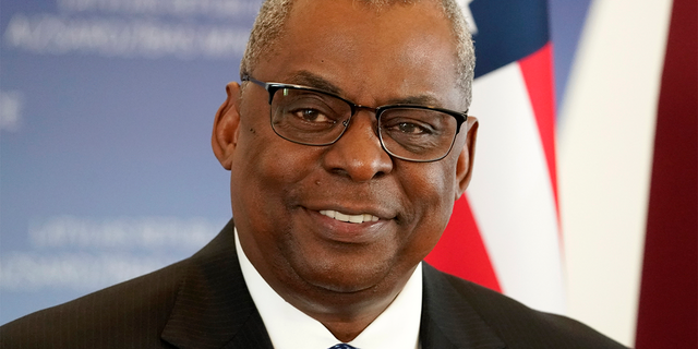 U.S. Secretary of Defense Lloyd Austin smiles during the press conference with Minister of Defence of Latvia Artis Pabriks during the press conference in Riga, Latvia, Wednesday, Aug. 10, 2022.