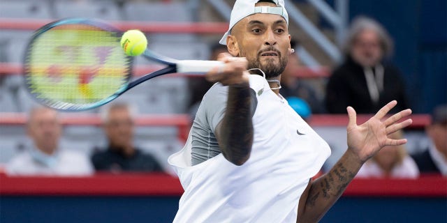 Nick Kyrgios, of Australia, returns to Sebastian Baez, of Argentina, during first round play at the National Bank Open tennis tournament Tuesday Aug. 9, 2022, in Montreal. 