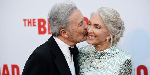 Attorney Bert Fields kisses his wife, art consultant Barbara Guggenheim, at the opening and inaugural dinner of the Broad Museum on Thursday, Sept. 17, 2015, in Los Angeles. 