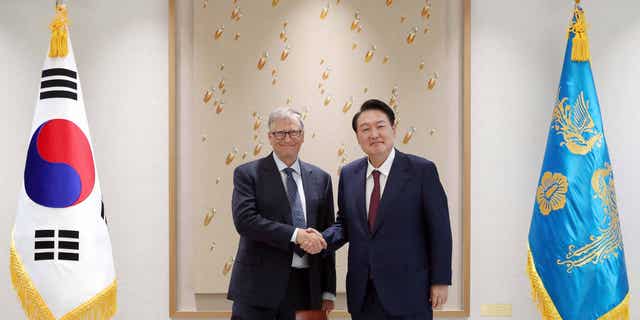Bill Gates (left) meets with South Korean President Yoon Suk-yeol (right) in the Presidential office in Seoul, South Korea, on Aug. 16, 2022, to discuss their plans to expand their global health partnership.