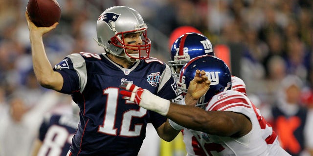 Quarterback Tom Brady of the New England Patriots passes against the New York Giants during Super Bowl XLII at the University of Phoenix Stadium in Glendale, Arizona, on Feb. 3, 2008.
