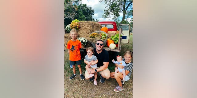Jared Bridegan with his four children on a pumpkin picking excursion.