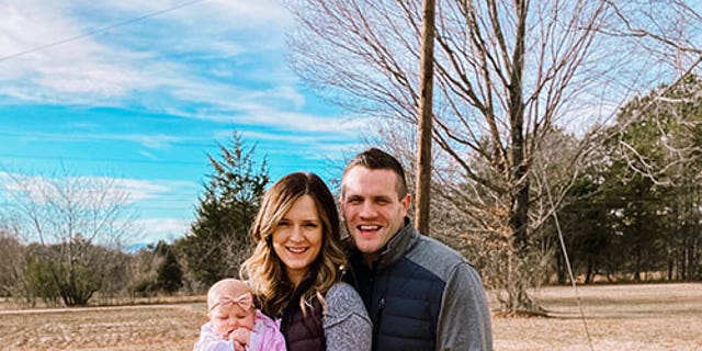 Kirsten Bridegan and her slain husband, Jared Bridegan, pose with daughter Bexley.