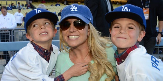 Britney Spears poses with sons Jayden James Federline (L) and Sean Preston Federline (R) during a Dodger game in 2013.