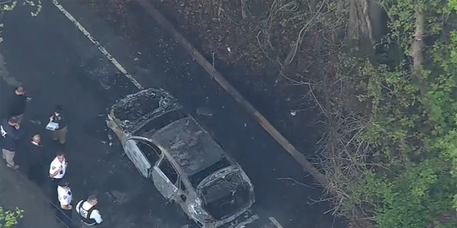 NYPD said two homicide victims were found in burning car. 
