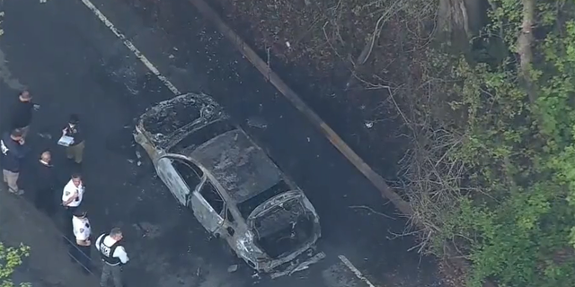 NYPD said two homicide victims were found in burning car. 