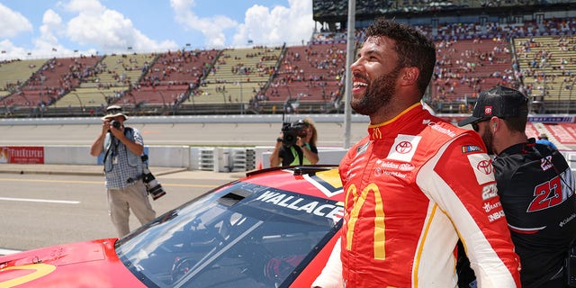 Bubba Wallace, driver of the No.  23 McDonald's Toyota, celebrates after winning pole for the NASCAR Cup Series FireKeepers Casino 400 at Michigan International Speedway August 6, 2022, in Brooklyn, Michigan.