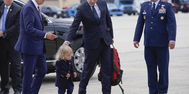 President Biden walks with his son Hunter Biden and grandson Beau Biden to board Air Force One at Andrews Air Force Base, Maryland, Wednesday, Aug. 10, 2022. The president is traveling to Kiawah Island, South Carolina, for vacation.