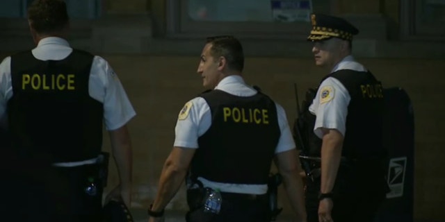 Chicago police seen leaving the press conference about the August 28 shooting.