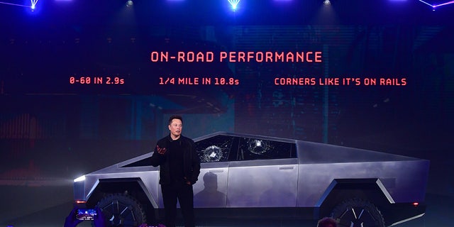 Elon Musk stands in front of the newly unveiled all-electric battery-powered Tesla's Cybertruck at Tesla Design Center in Hawthorne, California on Nov. 21, 2019. (Frederic J. Brown/AFP via Getty Images)