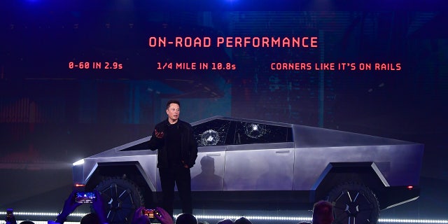 Elon Musk stands in front of the newly unveiled all-electric battery-powered Tesla's Cybertruck at Tesla Design Center in Hawthorne, California on Nov. 21, 2019. (Frederic J. Brown/AFP via Getty Images)
