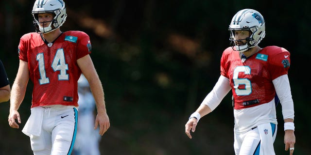 Sam Darnold (14) and Baker Mayfield (6) of the Carolina Panthers during training camp at Wofford College Aug. 2, 2022, in Spartanburg, S.C.